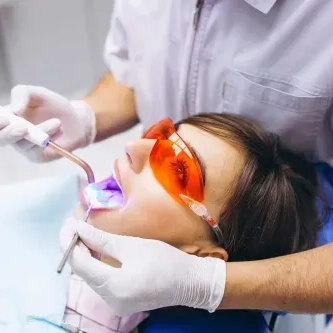 woman receiving an orthodontic exam